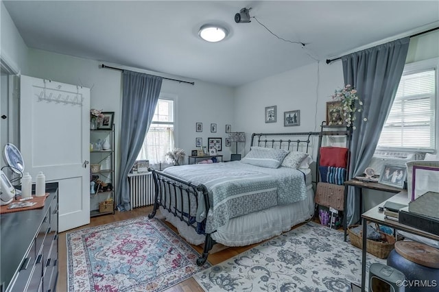 4821 W Seminary Ave, Richmond, VA 23227 - bedroom featuring radiator heating unit and wood finished floors