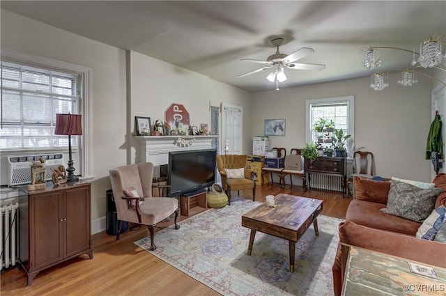 4821 W Seminary Ave, Richmond, VA 23227 - living area featuring ceiling fan, light wood-style flooring, and a fireplace
