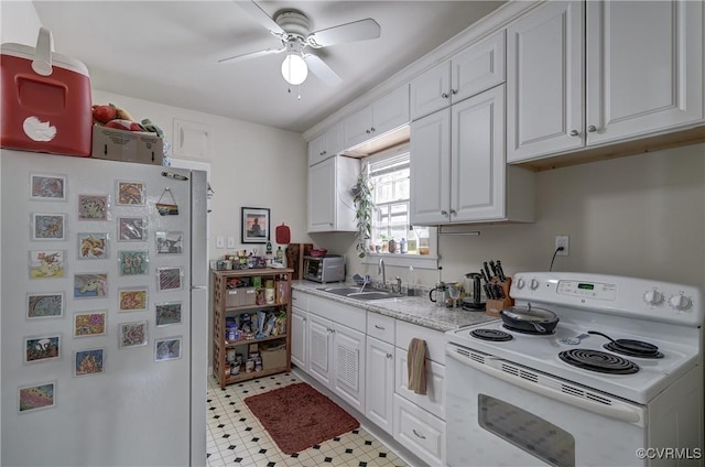 4821 W Seminary Ave, Richmond, VA 23227 - kitchen with a sink, white appliances, a ceiling fan, light countertops, and white cabinets