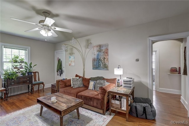 4821 W Seminary Ave, Richmond, VA 23227 - living area featuring wood finished floors, ceiling fan, arched walkways, and baseboards