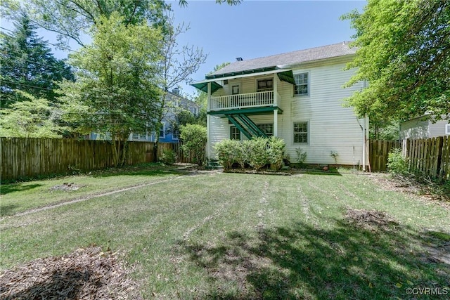 4821 W Seminary Ave, Richmond, VA 23227 - back of house with a lawn, a fenced backyard, and a balcony