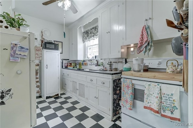 4821 W Seminary Ave, Richmond, VA 23227 - kitchen featuring white cabinetry, tasteful backsplash, ceiling fan, light floors, and white appliances
