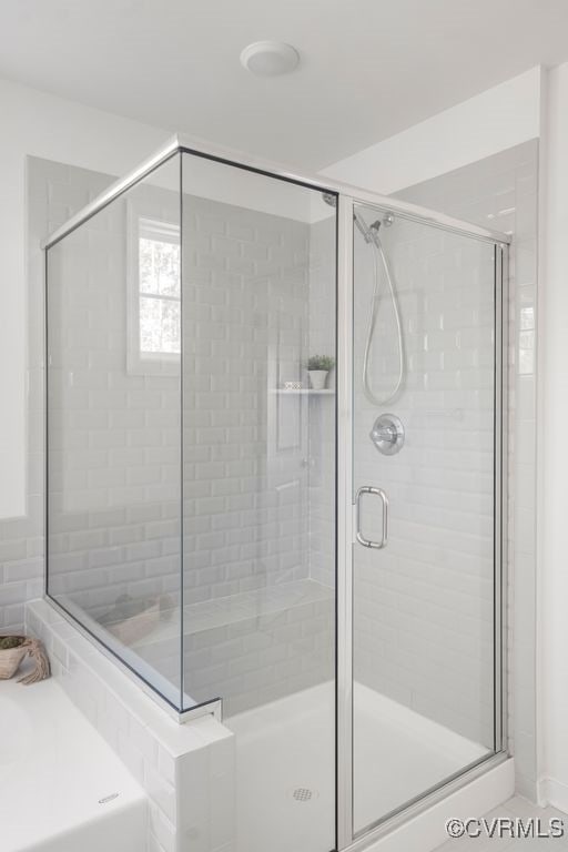 full bathroom featuring a shower stall