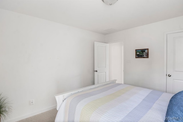 carpeted bedroom with baseboards