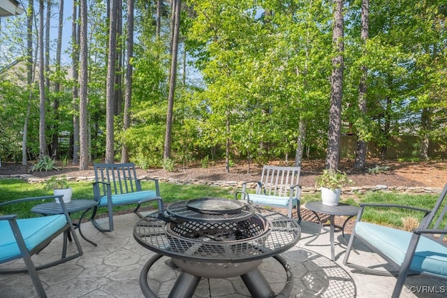 view of patio with an outdoor fire pit