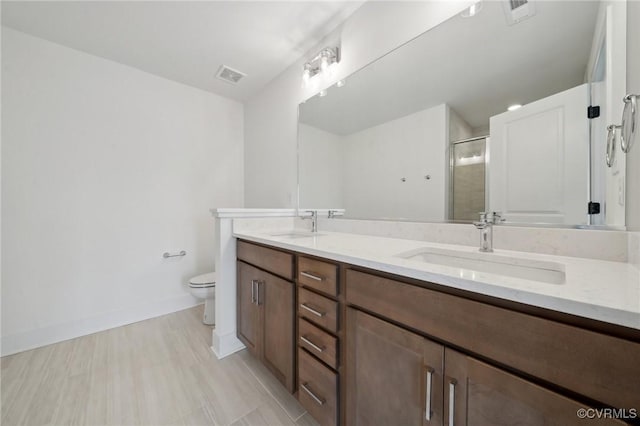 12141 Morning Walk, Henrico, VA 23233 - bathroom with double vanity, toilet, a stall shower, and baseboards