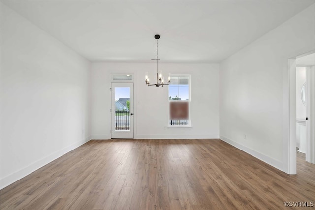 12141 Morning Walk, Henrico, VA 23233 - empty room with a chandelier, wood finished floors, and baseboards