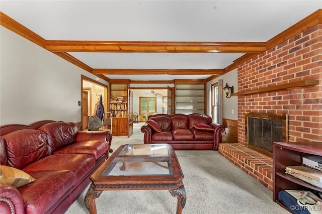 living room featuring carpet flooring, beamed ceiling, and a brick fireplace