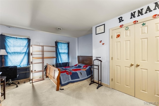 carpeted bedroom with baseboards