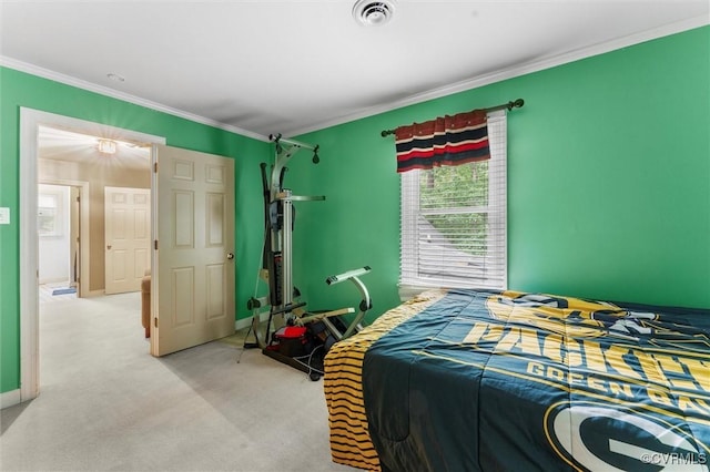 bedroom with ornamental molding, light colored carpet, and baseboards