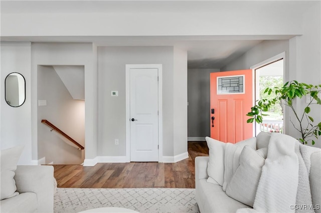 living room with baseboards and wood finished floors