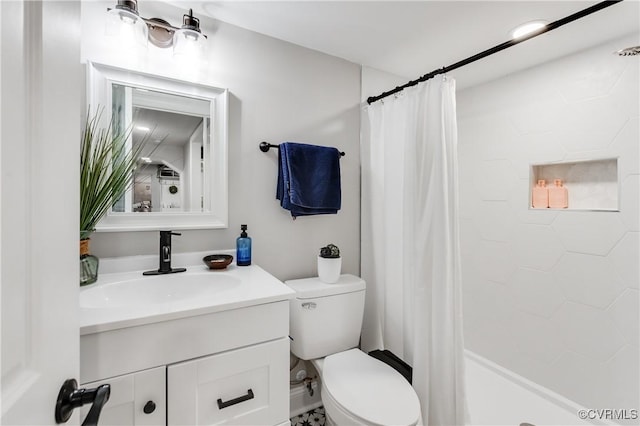 bathroom with vanity, curtained shower, and toilet