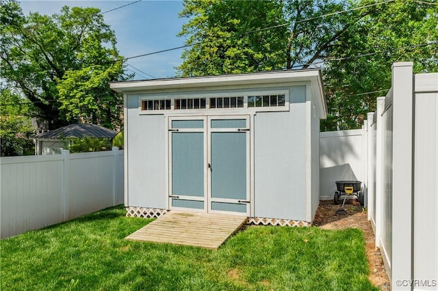 view of shed featuring a fenced backyard