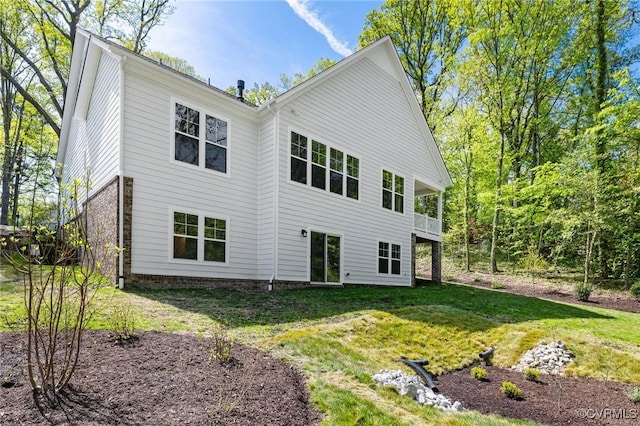 4236 Shirley Rd, Richmond, VA 23225 - rear view of house featuring a yard and brick siding