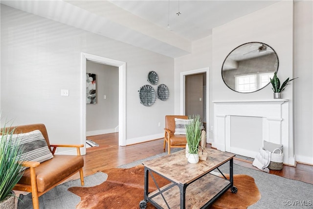 living room featuring wood finished floors and baseboards