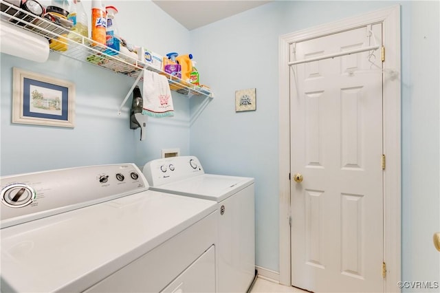 clothes washing area featuring laundry area and washer and dryer