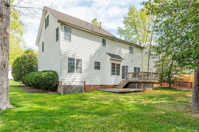 rear view of house with a wooden deck, fence, stairs, crawl space, and a yard