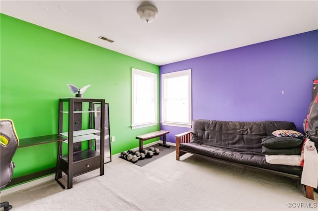 interior space featuring visible vents, carpet flooring, and baseboards