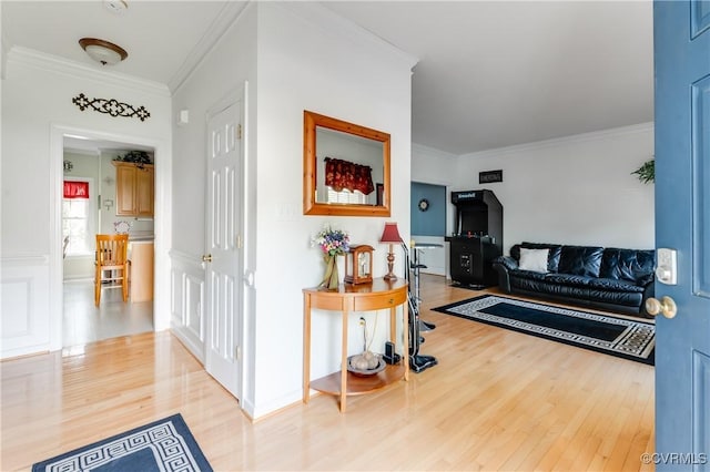 hall with crown molding and wood finished floors
