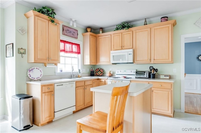 kitchen featuring crown molding, a sink, light brown cabinetry, and white appliances
