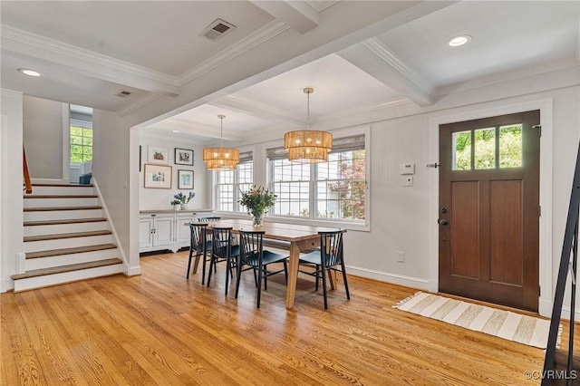 dining room with baseboards, light wood-style flooring, stairway, and beam ceiling