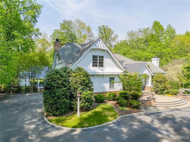 view of side of home with a chimney