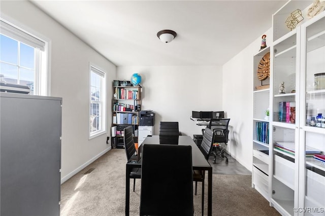 office space featuring plenty of natural light and baseboards