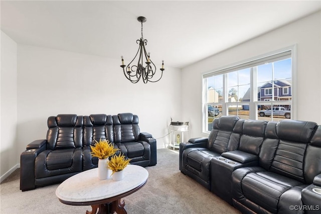 living room with carpet flooring, baseboards, and a notable chandelier