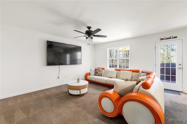living room with baseboards, carpet, and ceiling fan