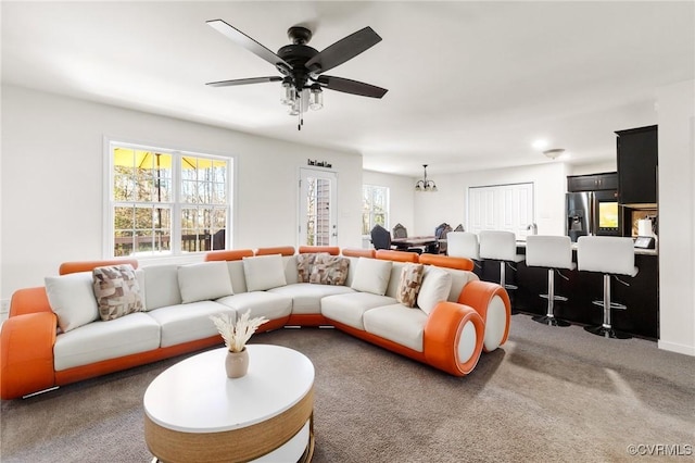 carpeted living room featuring ceiling fan