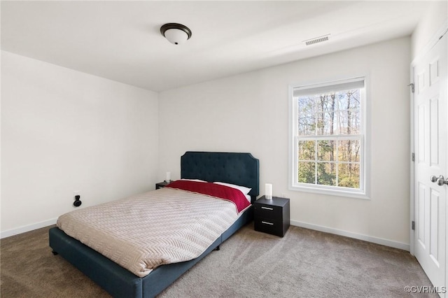 bedroom with visible vents, baseboards, and carpet floors