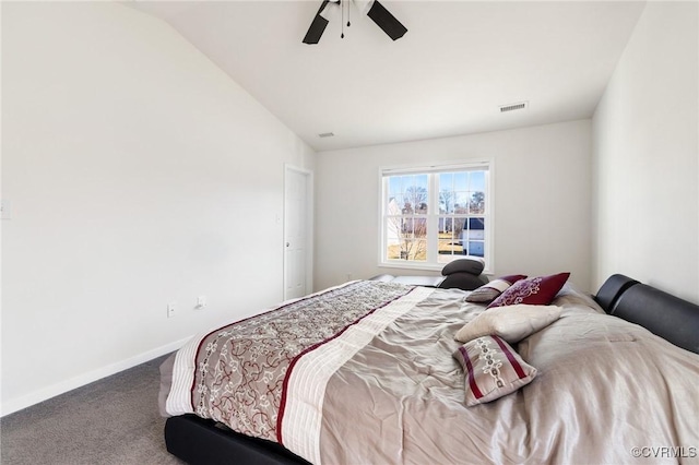bedroom with vaulted ceiling, ceiling fan, carpet floors, baseboards, and visible vents