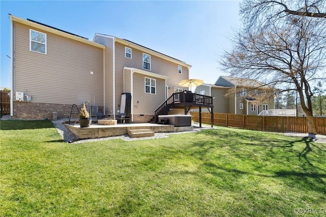 back of property with fence, a patio, a yard, and a deck
