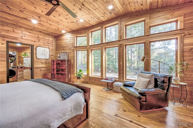 2793 Huguenot Springs Rd, Powhatan, VA 23113 - bedroom with wood ceiling, lofted ceiling, stacked washer / drying machine, and wooden walls