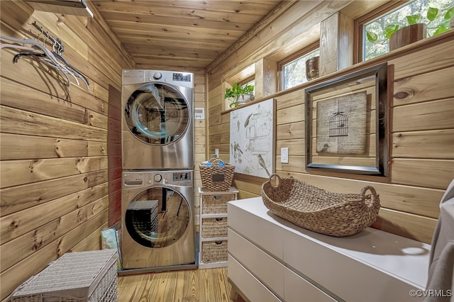 2793 Huguenot Springs Rd, Powhatan, VA 23113 - laundry room featuring stacked washer / drying machine, laundry area, wood walls, wooden ceiling, and light wood-type flooring