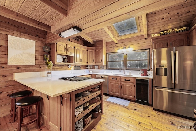 2793 Huguenot Springs Rd, Powhatan, VA 23113 - kitchen with open shelves, wood walls, beamed ceiling, a sink, and appliances with stainless steel finishes