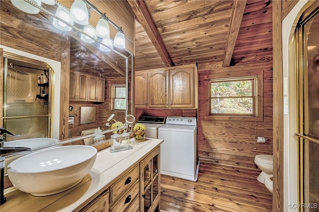 2793 Huguenot Springs Rd, Powhatan, VA 23113 - bathroom featuring beam ceiling, wood-type flooring, wood walls, washer and clothes dryer, and wood ceiling