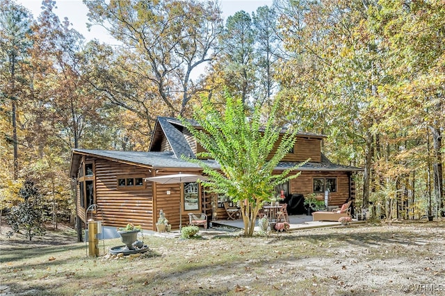 2793 Huguenot Springs Rd, Powhatan, VA 23113 - back of property featuring roof with shingles and a patio area