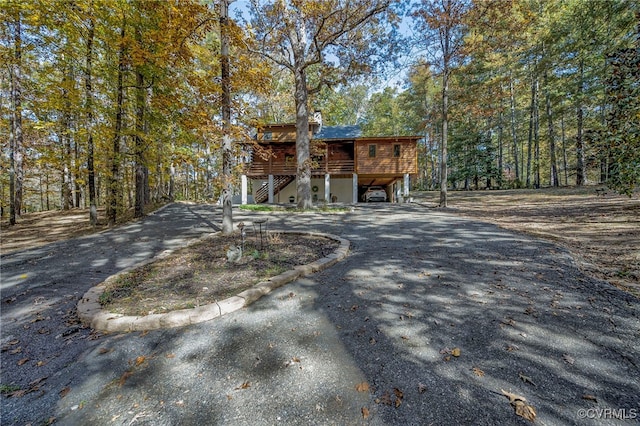 2793 Huguenot Springs Rd, Powhatan, VA 23113 - view of front of property featuring stairs, driveway, a wooded view, and a carport