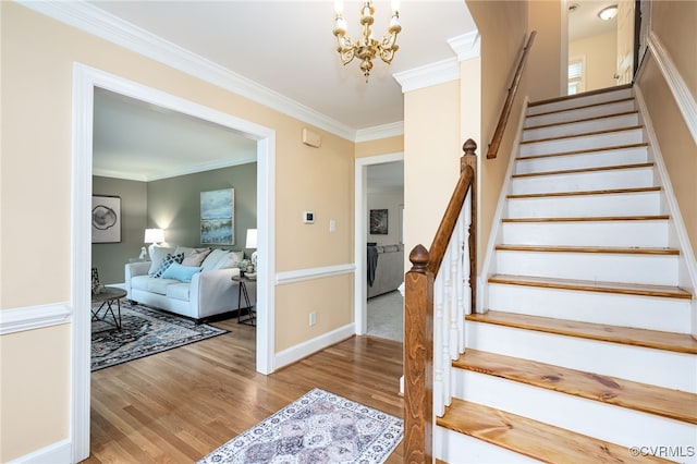 12911 Chipstead Rd, Chester, VA 23831 - stairway featuring wood finished floors, crown molding, a chandelier, and baseboards