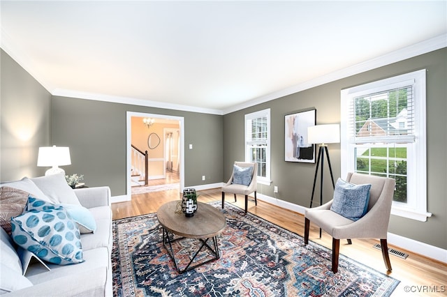 12911 Chipstead Rd, Chester, VA 23831 - living area featuring plenty of natural light, stairs, ornamental molding, and light wood-style floors