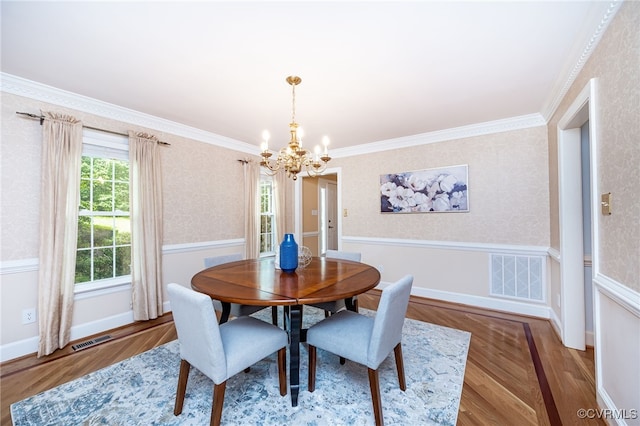 12911 Chipstead Rd, Chester, VA 23831 - dining room featuring a chandelier, wood finished floors, wallpapered walls, crown molding, and baseboards