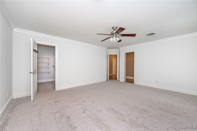12911 Chipstead Rd, Chester, VA 23831 - unfurnished bedroom featuring ornamental molding, carpet, baseboards, ceiling fan, and a walk in closet
