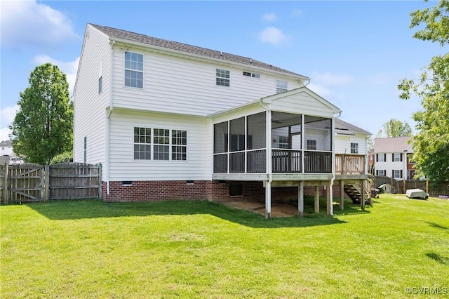 back of property featuring fence, a sunroom, stairs, crawl space, and a lawn
