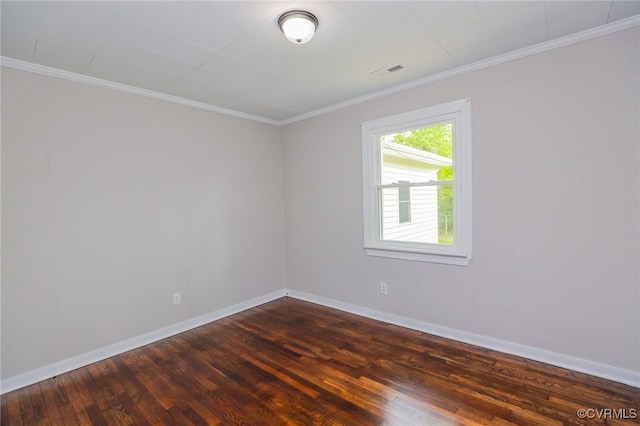unfurnished room featuring baseboards, ornamental molding, and dark wood-style floors