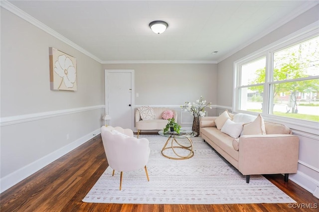living room with baseboards, ornamental molding, and wood finished floors