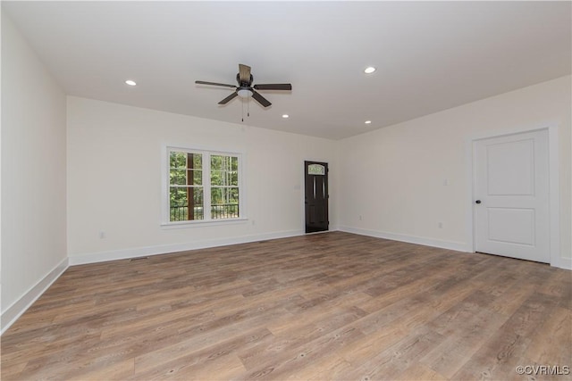 unfurnished room featuring light wood finished floors, baseboards, recessed lighting, and ceiling fan