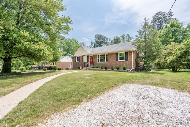 ranch-style home featuring central air condition unit, a front yard, and brick siding