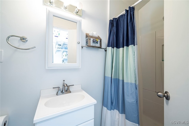 bathroom with vanity and a shower with shower curtain