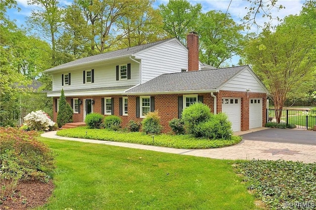 331 Harwick, North Chesterfield, VA 23236 - traditional home featuring a front yard, an attached garage, a chimney, and fence